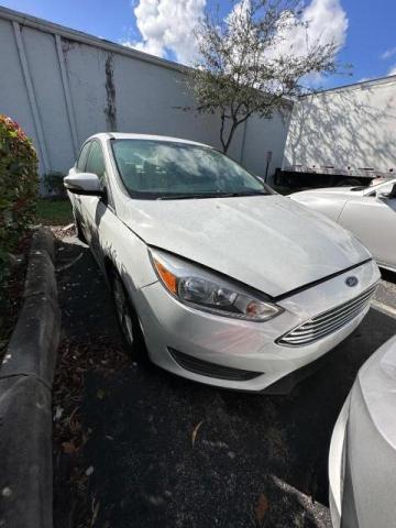 FORD FOCUS SE 2016 with VIN 1FADP3F22GL339090 - Photo from auction