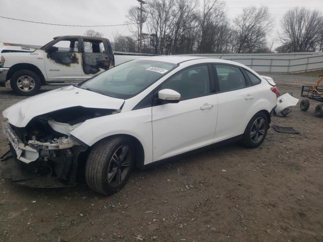 FORD FOCUS SE 2014 with VIN 1FADP3F29EL141703 - Photo from auction