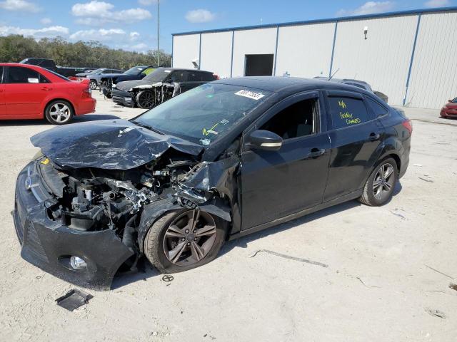 FORD FOCUS SE 2014 with VIN 1FADP3F20EL310720 - Photo from auction