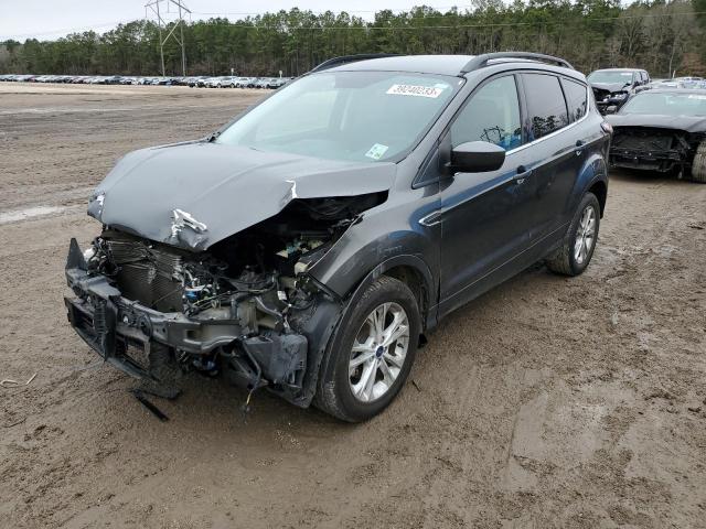 FORD ESCAPE SE 2018 with VIN 1FMCU0GD9JUB04440 - Photo from auction
