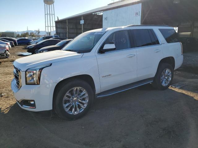 GMC YUKON SLE 2019 with VIN 1GKS1AKC6KR137787 - Photo from auction