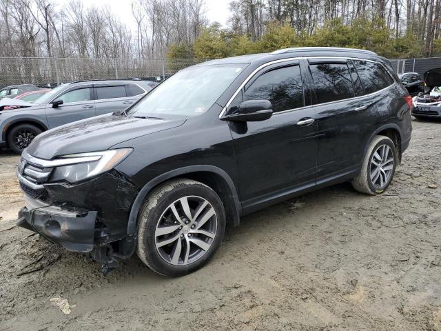 HONDA PILOT TOUR 2017 with VIN 5FNYF6H98HB065232 - Photo from auction