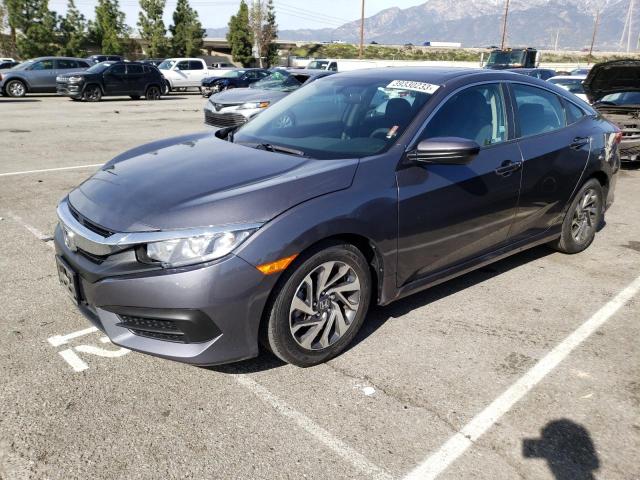 HONDA CIVIC EX 2018 with VIN 2HGFC2F71JH585414 - Photo from auction