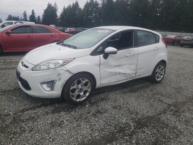FORD FIESTA SES 2011 with VIN 3FADP4FJ2BM217060 - Photo from auction