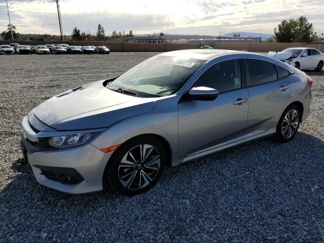 HONDA CIVIC EX 2018 with VIN JHMFC1F30JX040529 - Photo from auction