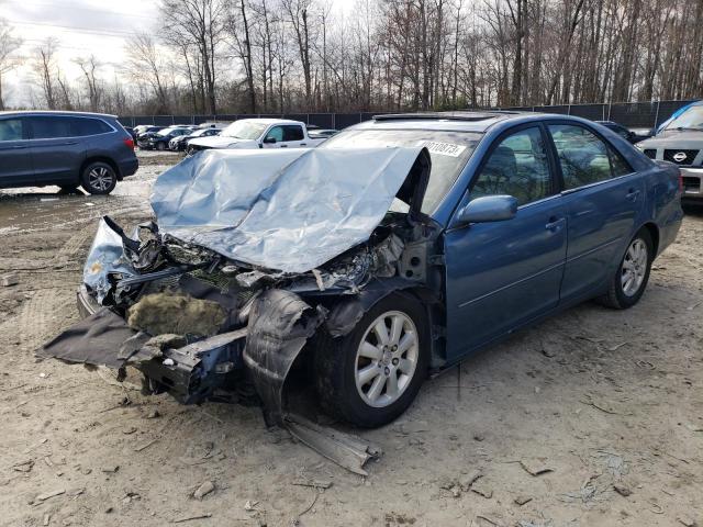 TOYOTA CAMRY LE 2003 with VIN 4T1BE30KX3U763777 - Photo from auction
