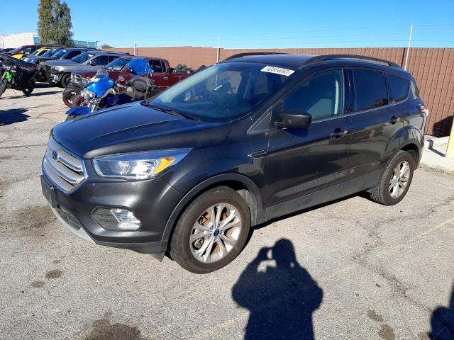 FORD ESCAPE SE 2018 with VIN 1FMCU9GD2JUA74198 - Photo from auction