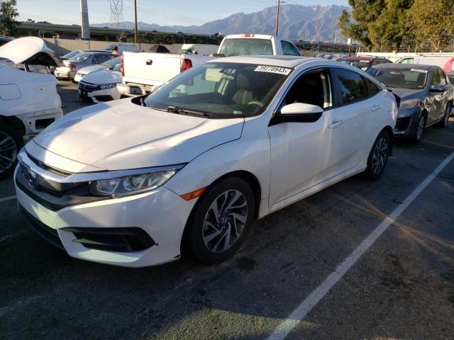 HONDA CIVIC EX 2018 with VIN 2HGFC2F77JH555690 - Photo from auction