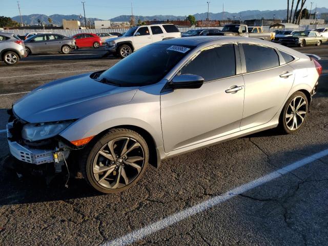 HONDA CIVIC SI 2018 with VIN 2HGFC1E52JH701035 - Photo from auction