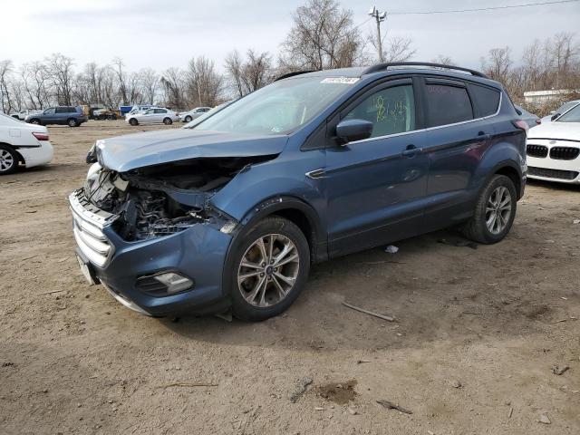 FORD ESCAPE SE 2018 with VIN 1FMCU9GD9JUB10033 - Photo from auction