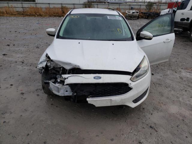 Photo 11 from auction – 2015 FORD FOCUS SE with VIN 1FADP3K20FL295210