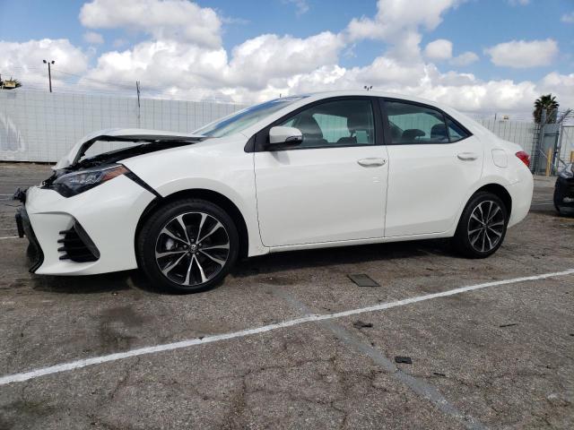 TOYOTA COROLLA L 2019 with VIN 5YFBURHE8KP878611 - Photo from auction