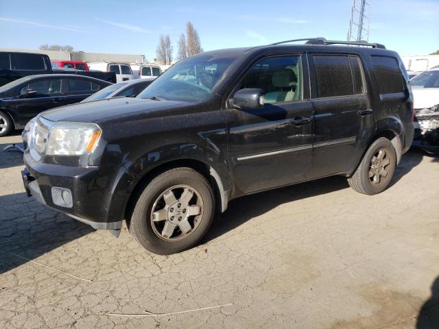 HONDA PILOT TOUR 2010 with VIN 5FNYF4H94AB025210 - Photo from auction