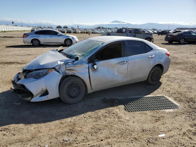 TOYOTA COROLLA L 2019 with VIN 5YFBURHE8KP937575 - Photo from auction