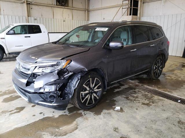 HONDA PILOT TOUR 2021 with VIN 5FNYF5H66MB039772 - Photo from auction
