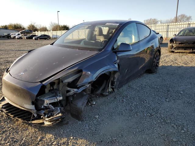 TESLA MODEL Y 2023 with VIN 7SAYGDEF7PF615534 - Photo from auction