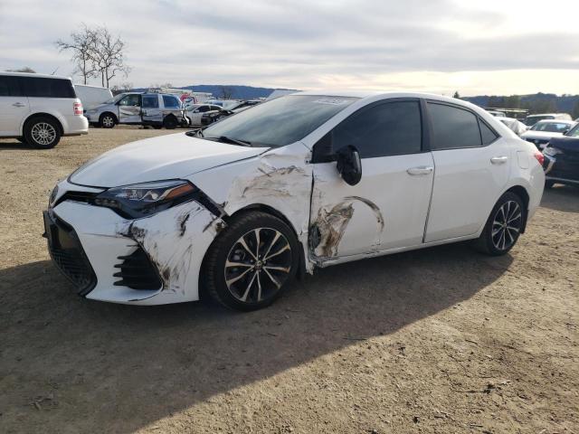 TOYOTA COROLLA L 2019 with VIN 2T1BURHEXKC244880 - Photo from auction