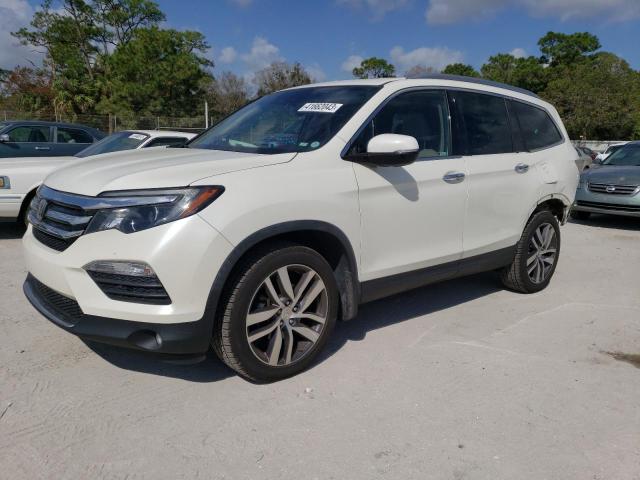 HONDA PILOT TOUR 2018 with VIN 5FNYF5H97JB022629 - Photo from auction