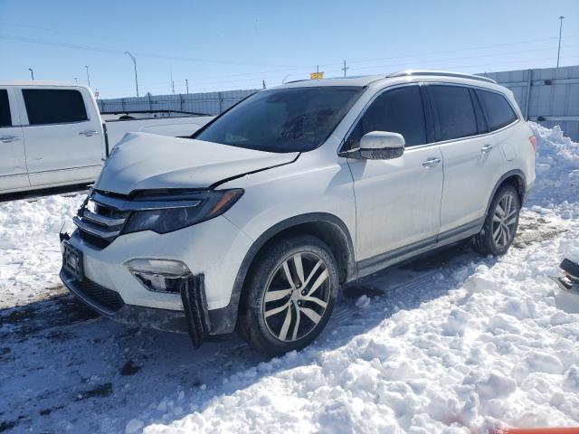 HONDA PILOT TOUR 2016 with VIN 5FNYF6H90GB042302 - Photo from auction