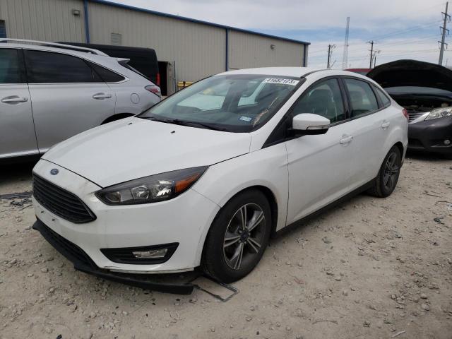 FORD FOCUS SE 2016 with VIN 1FADP3FE1GL404828 - Photo from auction