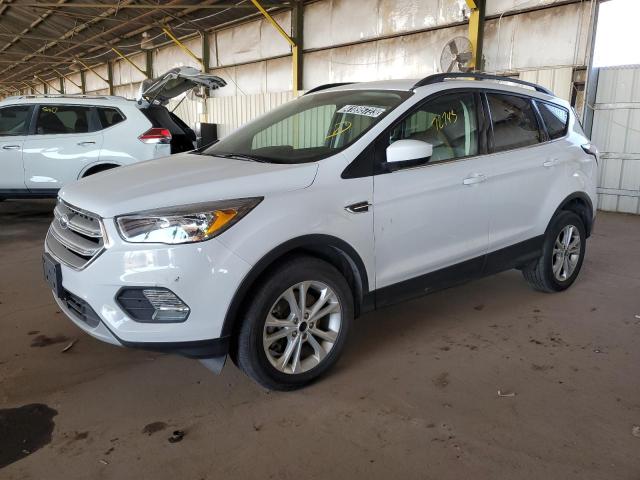 FORD ESCAPE SE 2018 with VIN 1FMCU9GD7JUD06617 - Photo from auction