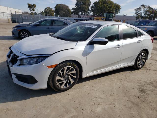 HONDA CIVIC EX 2018 with VIN 19XFC2F74JE205430 - Photo from auction