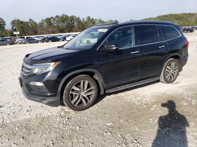 HONDA PILOT TOUR 2016 with VIN 5FNYF5H98GB035804 - Photo from auction