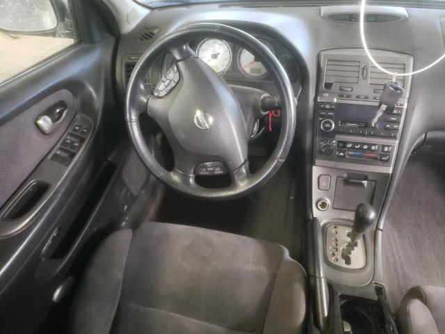 Photo 8 from auction – 2003 NISSAN MAXIMA with VIN JN1DA31D03T520464