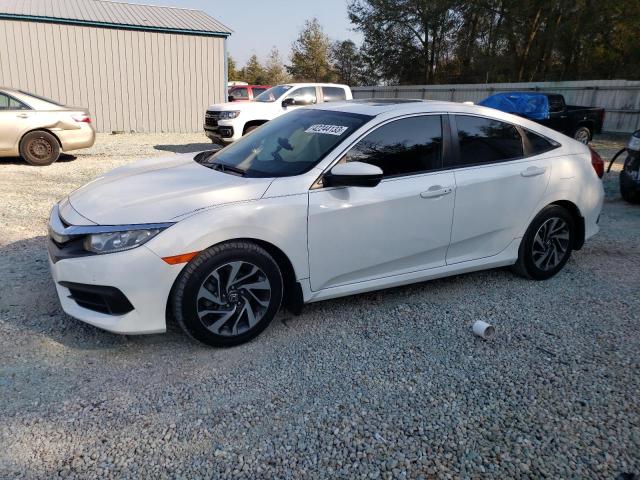 HONDA CIVIC EX 2018 with VIN 19XFC2F75JE007682 - Photo from auction