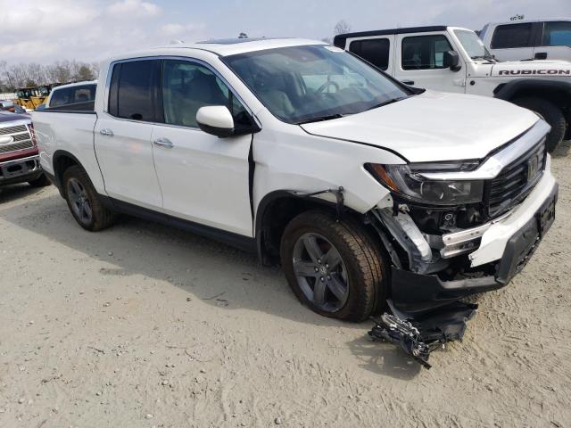 Photo 4 from auction – 2022 HONDA RIDGELINE with VIN 5FPYK3F79NB007970