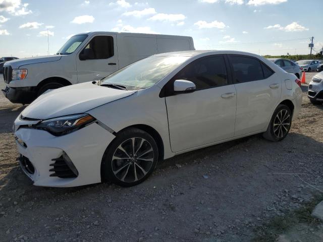 TOYOTA COROLLA L 2018 with VIN 5YFBURHE5JP749496 - Photo from auction