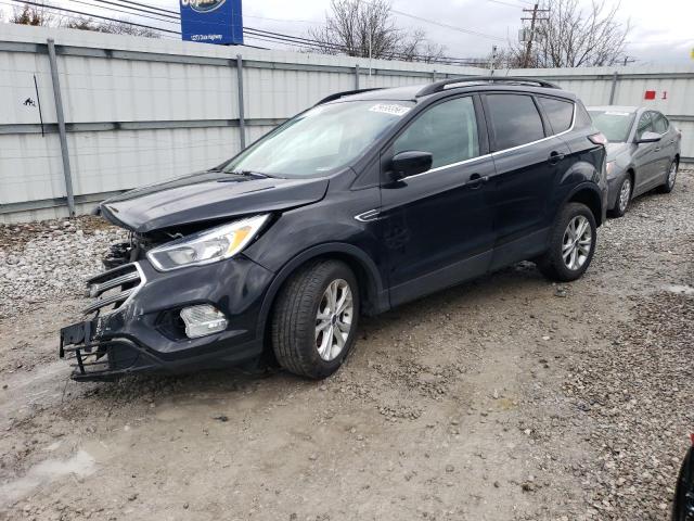 FORD ESCAPE SE 2018 with VIN 1FMCU9GD9JUC72776 - Photo from auction