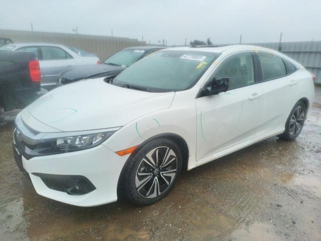 HONDA CIVIC EX 2018 with VIN JHMFC1F47JX020044 - Photo from auction
