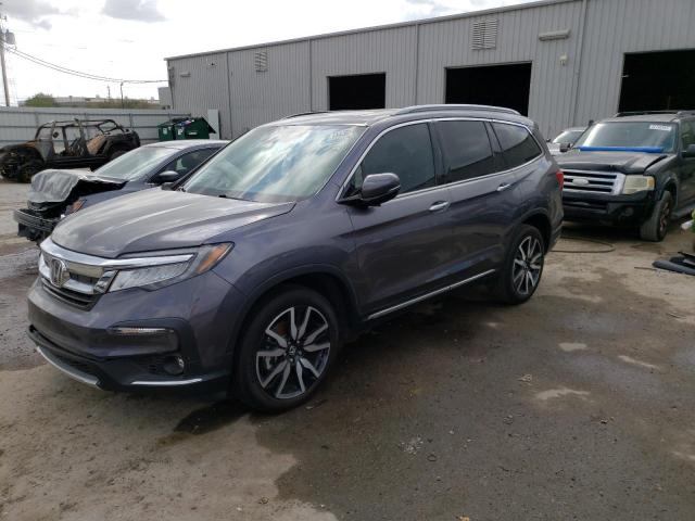 HONDA PILOT TOUR 2022 with VIN 5FNYF5H95NB017158 - Photo from auction