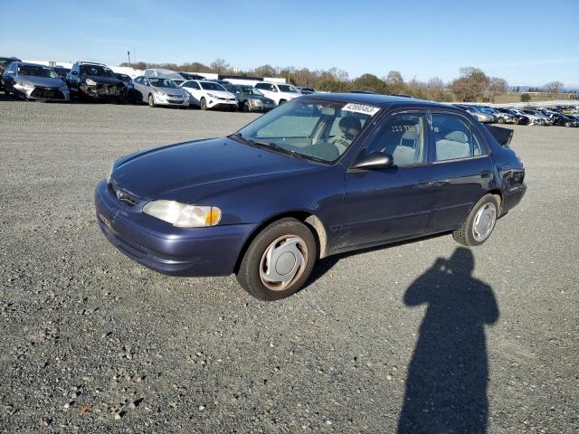 TOYOTA COROLLA VE 2000 with VIN 1NXBR12E9YZ338011 - Photo from auction