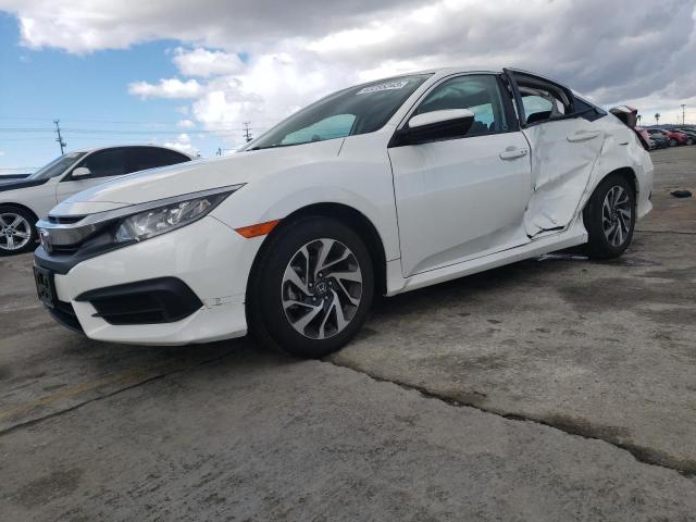 HONDA CIVIC EX 2018 with VIN 19XFC2F74JE207548 - Photo from auction