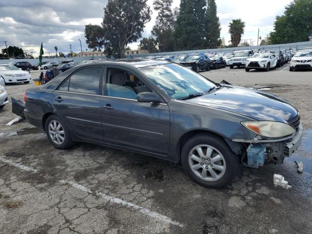 Photo 4 from auction – 2002 TOYOTA CAMRY LE with VIN JTDBE32K520070297