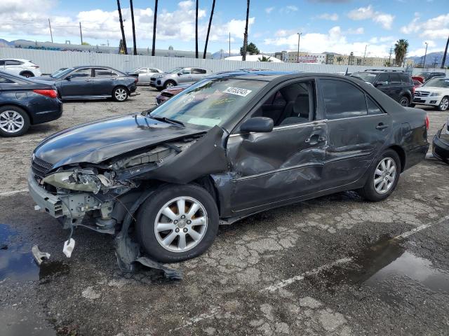 TOYOTA CAMRY LE 2002 with VIN JTDBE32K520070297 - Photo from auction
