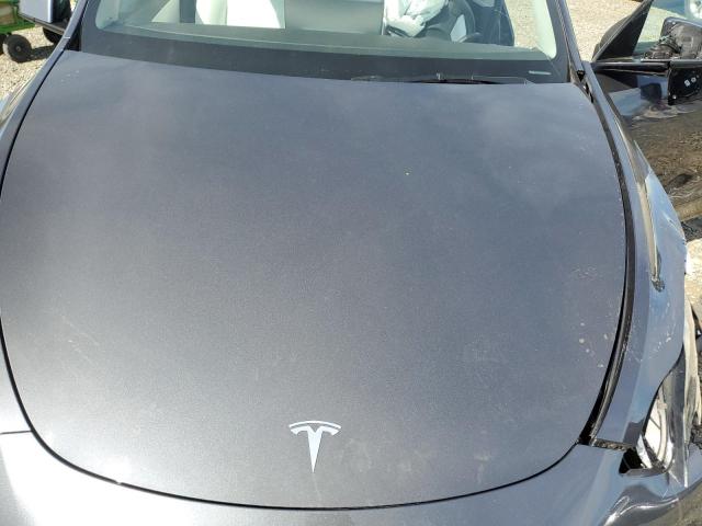 Photo 11 from auction – 2022 TESLA MODEL Y with VIN 7SAYGDEE7NF355690