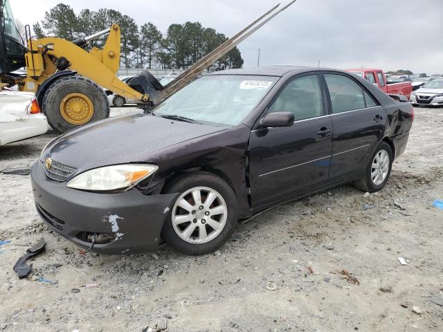 TOYOTA CAMRY LE 2003 with VIN 4T1BE30K23U761828 - Photo from auction