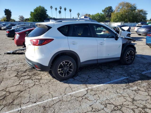 Photo 3 from auction – 2014 MAZDA CX-5 TOURI with VIN JM3KE2CY3E0346274