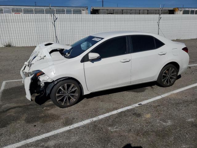 TOYOTA COROLLA L 2018 with VIN 5YFBURHE9JP748786 - Photo from auction
