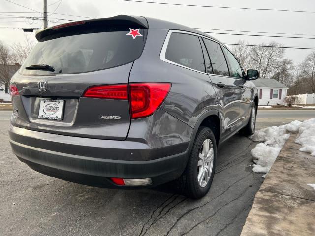 Photo 4 from auction – 2018 HONDA PILOT LX with VIN 5FNYF6H12JB029634