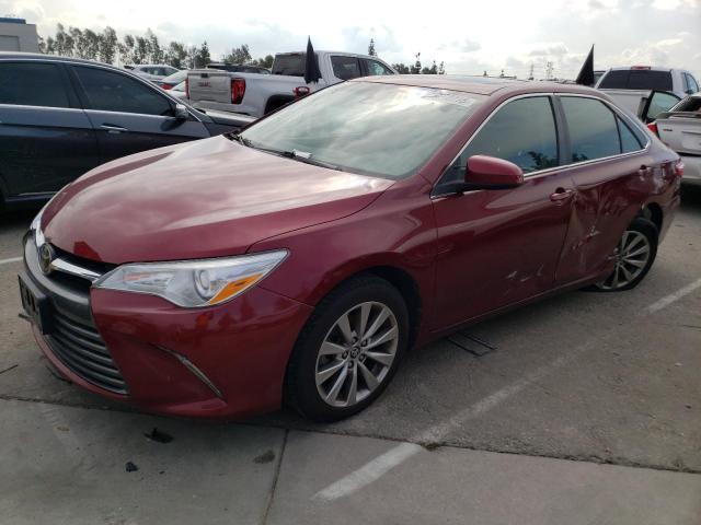 TOYOTA CAMRY LE 2017 with VIN 4T1BF1FKXHU703594 - Photo from auction