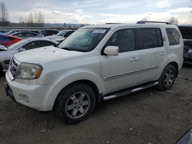 HONDA PILOT TOUR 2011 with VIN 5FNYF4H96BB057707 - Photo from auction