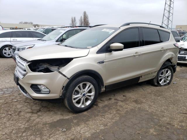 FORD ESCAPE SE 2018 with VIN 1FMCU9GD7JUB44648 - Photo from auction