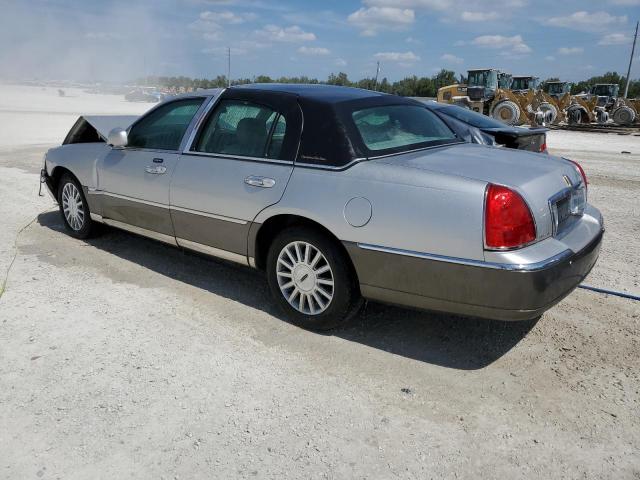 Photo 2 from auction – 2004 LINCOLN TOWN CAR E with VIN 1LNHM81W14Y655733
