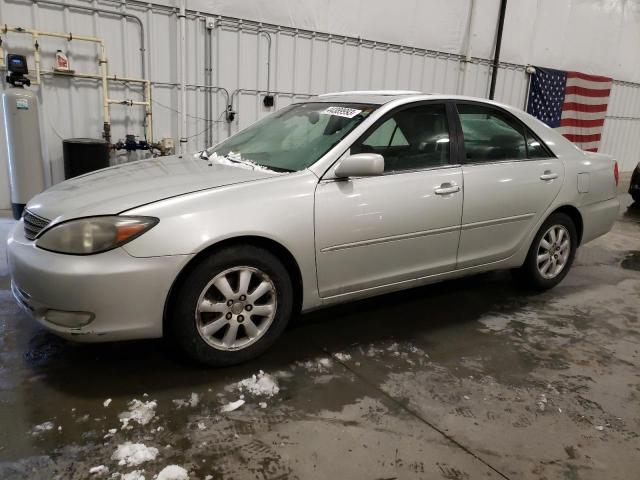 TOYOTA CAMRY LE 2003 with VIN JTDBF30K130148818 - Photo from auction