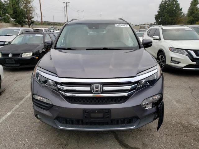 Photo 5 from auction – 2017 HONDA PILOT TOUR with VIN 5FNYF6H90HB033102