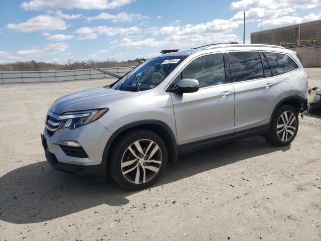 HONDA PILOT TOUR 2018 with VIN 5FNYF6H95JB039998 - Photo from auction